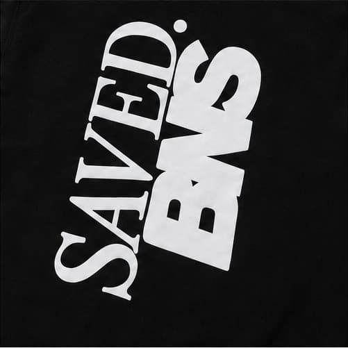 Close-up of the SAVED. BNS back print, letterforms overlapping at an angle